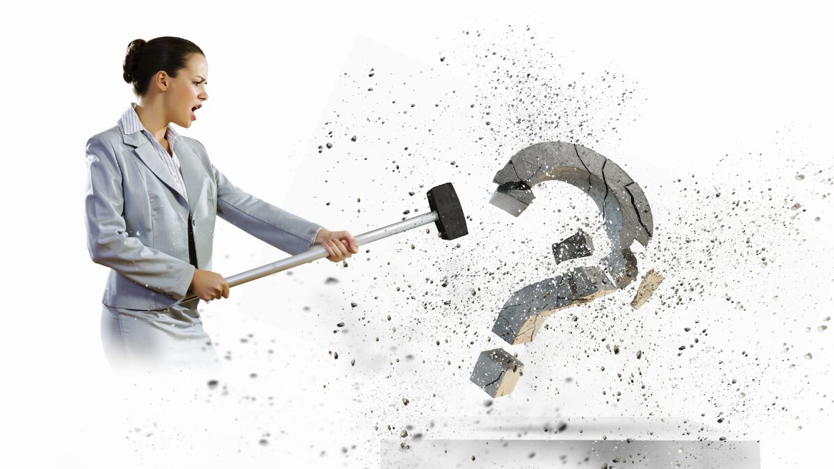 Symbolic for essential transformative skills: A woman with a sledgehammer destroying a massive questionmark