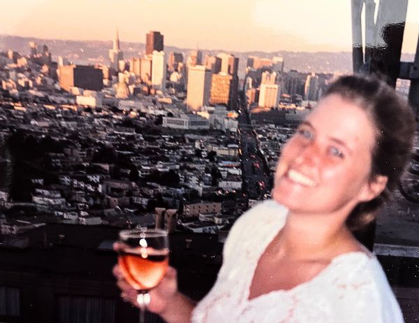 Birgit Gosejacob enjoying a glass of vine after work on her balcony overlooking San Francisco